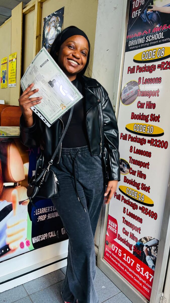 Thabo La Kgosi Driving School student smiling with her licence